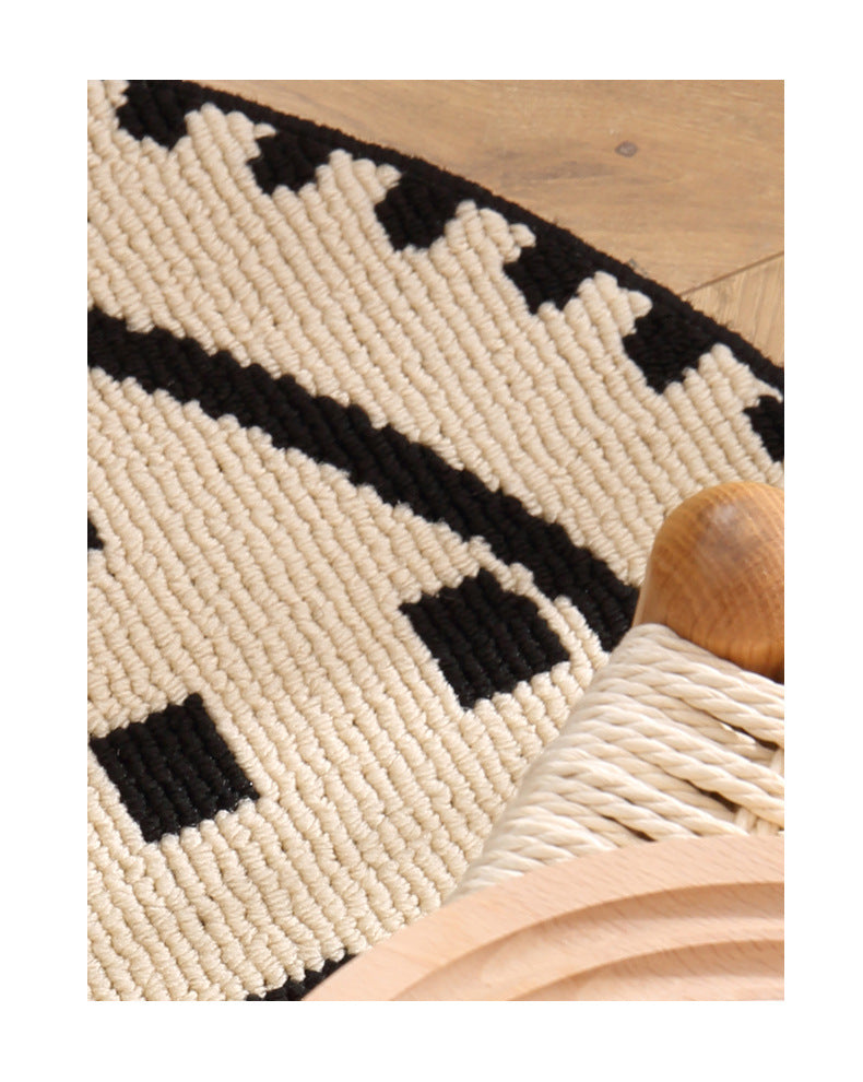 Meragh Black Modern Round Area Rug with Geometric Black and White Pattern